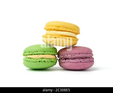 round baked multi-colored almond flour cakes macarons, dessert is stacked Stock Photo