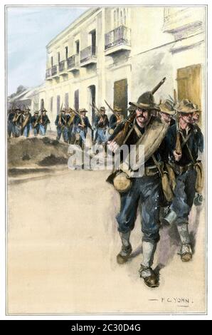 Third Wisconsin Volunteers entering Cuomo, Puerto Rico,  Spanish-American War, 1898. Hand-colored halftone of an F.C. Yohn illustration Stock Photo