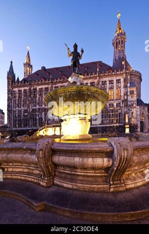 Karlsbrunnen in front of the city hall, dusk, Old Town, Aachen, North Rhine-Westphalia, Germany Stock Photo