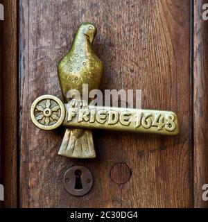 Door handle with lettering Friede 1648, Peace of Westphalia, City Hall, Osnabrueck, Lower Saxony, Germany Stock Photo
