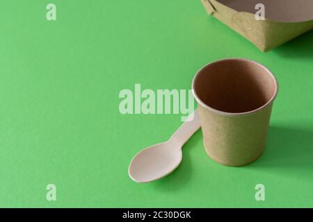 Eco friendly disposable dishes, glass with a spoon and a plate of environmental material Stock Photo