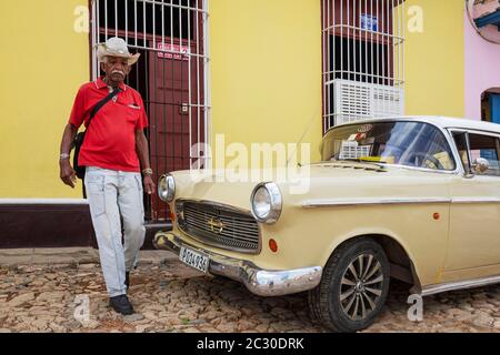 Classic car Opel Kapitaen and passer-by, Trinidad, Cuba Stock Photo