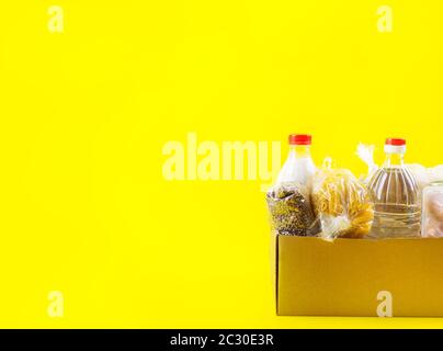 Food staples delivery or donation box concept Stock Photo