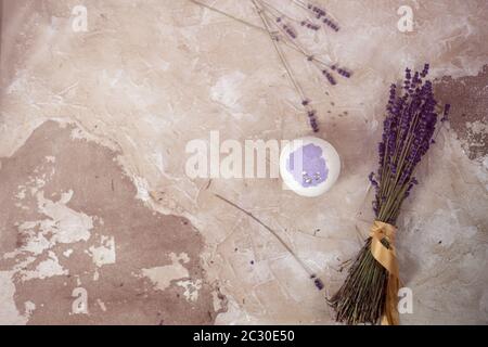 Natural cosmetics. Handmade lavender bath bomb, lavender flowers in a wooden tray on vintage back Stock Photo