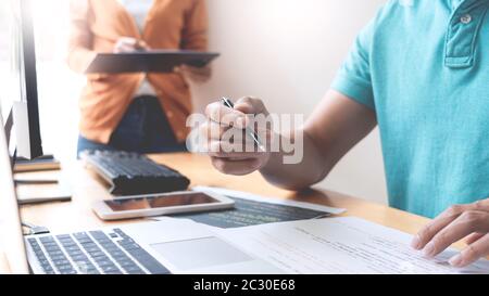 Asian team Outsource Developer Looking Screen Programming Code Working with Laptop Computer Software Stock Photo