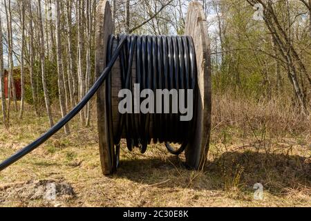 High voltage cabel on a big roll picture from Northern Sweden. Stock Photo