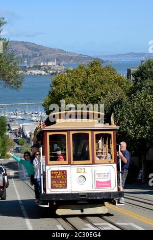 Cable Car on Hyde Street, in the background the prison island Alcatraz, San Francisco, California, USA Stock Photo