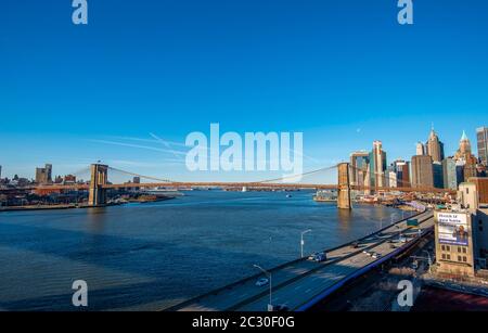 View from Manhattan Bridge over the East River to the skyline of Lower Manhattan and Brooklyn Bridge, Manhattan, New York, USA Stock Photo