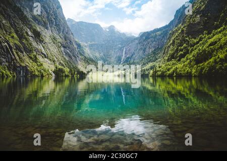 Scenic Lake Obersee on a beautiful day with blue sky and clouds in summer, Berchtesgadener Land, Upper Bavaria, Germany Stock Photo
