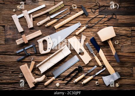 Various Carpenter Tools From Toolkit Laying On Desk Stock Photo