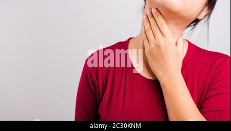 Asian beautiful woman itching her scratching her itchy neck on white background with copy space, Medical and Healthcare concept Stock Photo
