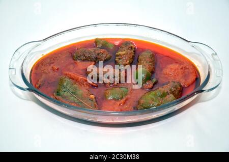 Kufta bozbash Middle Eastern mutton soup . Bowl of Bozbash - delicious Azerbaijan national soup on the table with white flowers Stock Photo