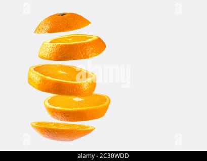 Orange sliced floating on white background Stock Photo