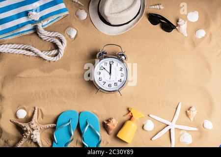 Alarm Clock In Sand On Sunny Tropical Beach Stock Photo