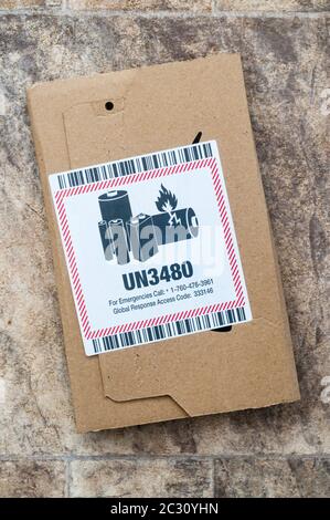 UN3480 label on a packet containing a Lithium ion battery. Stock Photo