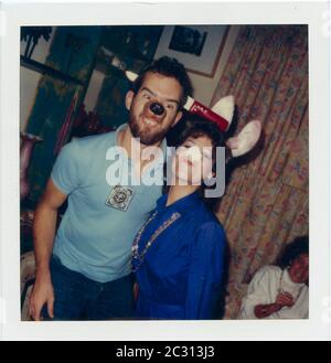 Couple at party during Greenwich Village Halloween Parade, New York City, USA in the 1980's Scan of SX-70 print Stock Photo