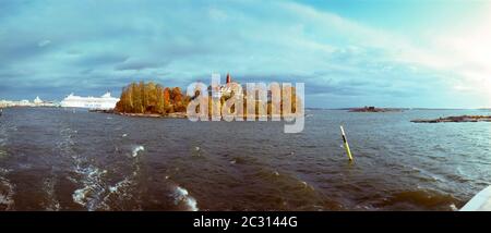 View of trees and house on Valkosaari island in cloudy day, Helsinki, Finland Stock Photo