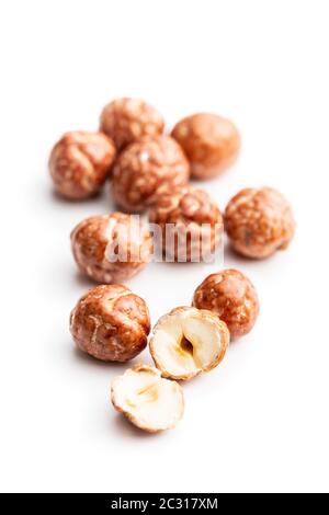 Hazelnuts with sugar icing isolated on white background. Stock Photo