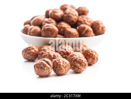 Hazelnuts with sugar icing isolated on white background. Stock Photo
