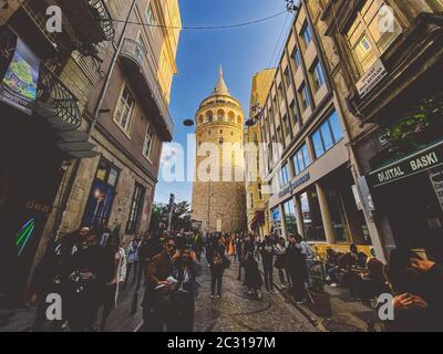 Galata Tower and the street in the Old Town of Istanbul, Turkey October 27, 2019. BELTUR Galata Kulesi or Galata tower in the ol Stock Photo