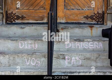 Detroit, Michigan - A message chalked on the steps of Ste. Anne de Detroit Catholic Church. Founded in 1701 by French colonists, the parish is now mos Stock Photo