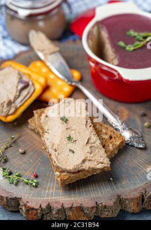 Slice of bread with chicken liver pate with thyme. Stock Photo