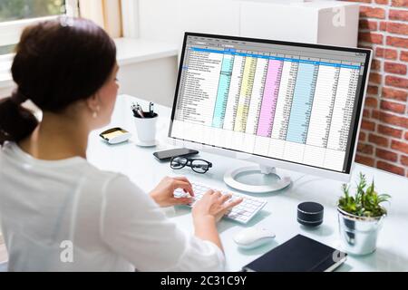 Working With Spreadsheet. Analyzing Data On Laptop Screen Stock Photo