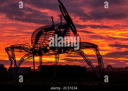 FARO, PORTUGAL: 8th DECEMBER 2019 - Crab statue in the natural marshlands at sunset located in Ria Formosa, Algarve, Portugal. Stock Photo