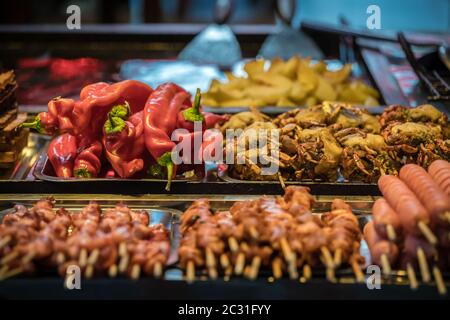 Hot buffet ingredients on sticks Stock Photo