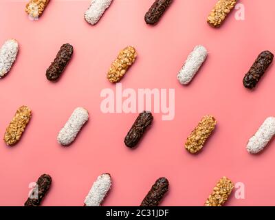 eclairs or profitroles pattern on pink background Stock Photo