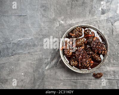 Jam with baby pine cones Stock Photo