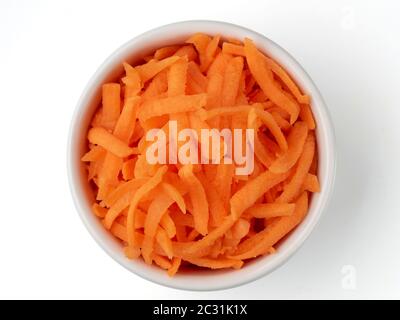 Grated carrots isolated on white Stock Photo