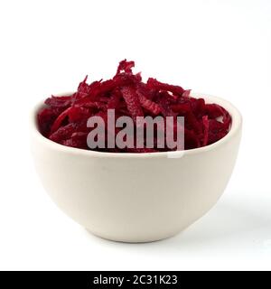 Grated beetroot in ceramic bowl isolated on white Stock Photo