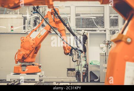 robotic automatic arms in the factory stopped because of slowing the economy and stop production. Stock Photo