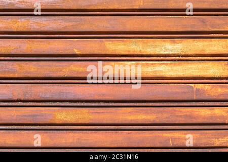 Rusty metal shutter gate. Grungy background texture. Stock Photo