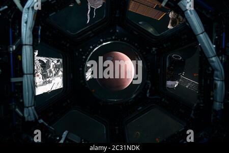 Mars. View of the red planet of the solar system from porthole of spaceship. 3D Render. Science fiction Stock Photo