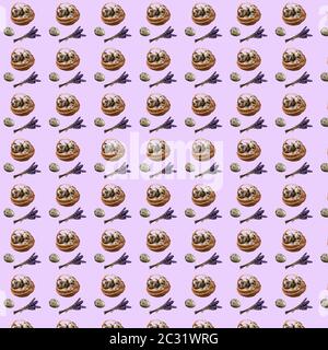 Seamless pattern with repeating Easter basket objects i eggs, quail egg and a bouquet of dry lavender on a purple background Stock Photo