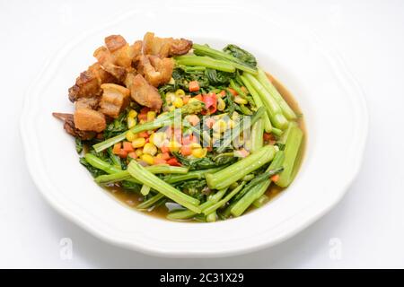 Stir fried Chinese kale with oyster sauce and pork Stock Photo