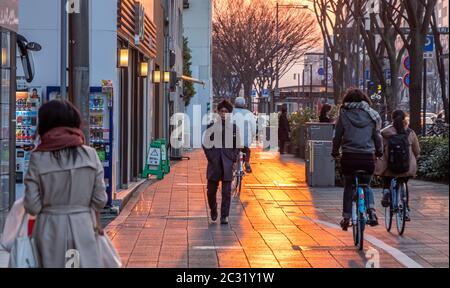 People in the street of Kyoto at sunset, Japan Stock Photo