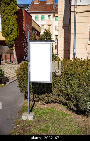 Blank vertical street billboard poster on city background Stock Photo