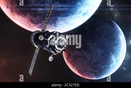 Space station among planets in deep space in blue and red light Stock Photo