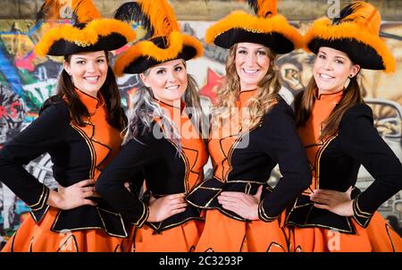 Cheerful German folklore group dancing in Carnival Fasching on Rose Monday Stock Photo