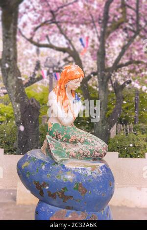 The Little Mermaid from Hans Christian Andersen's book under the cherry blossoms of Asukayama Park Stock Photo