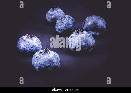 Group of blueberries on black background Stock Photo