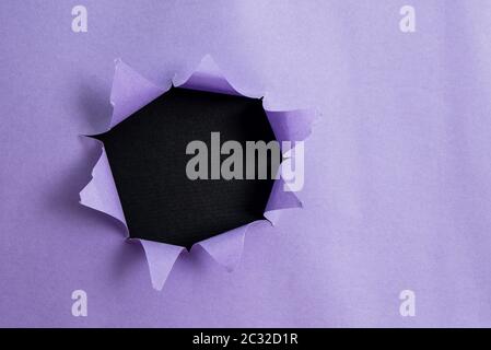 Rolled Ripped Torn Cardboard Placed Above A Wooden Classic Table Backdrop Stock Photo