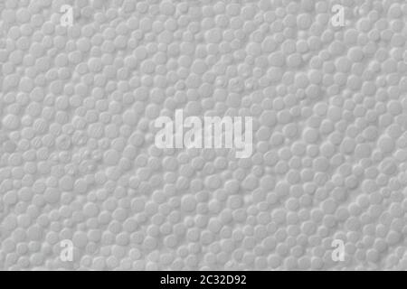 Simple texture of white polystyrene foam or styrofoam, close-up flat white on white background Stock Photo