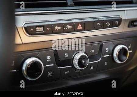 Air ducts and climate control panel in a luxury car with leather top panel. Stock Photo