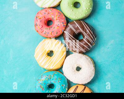 donuts on blue background, top view Stock Photo
