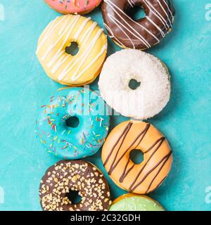 donuts on blue background, top view Stock Photo