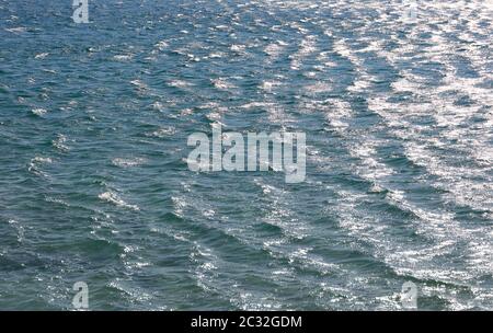 Blue sea water surface with ripples and waves, high angle view Stock Photo